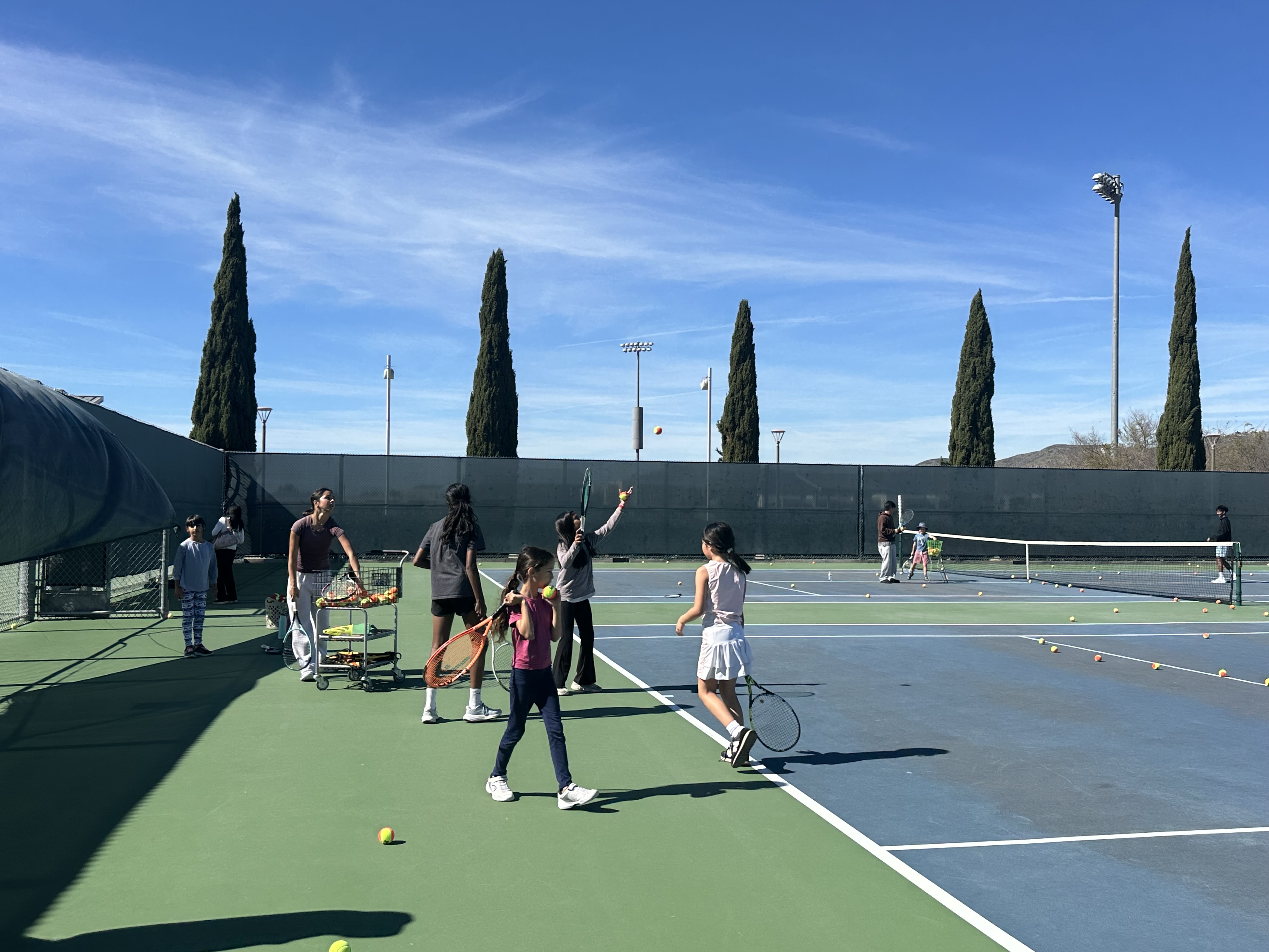 volunteer coach with kids, courtside